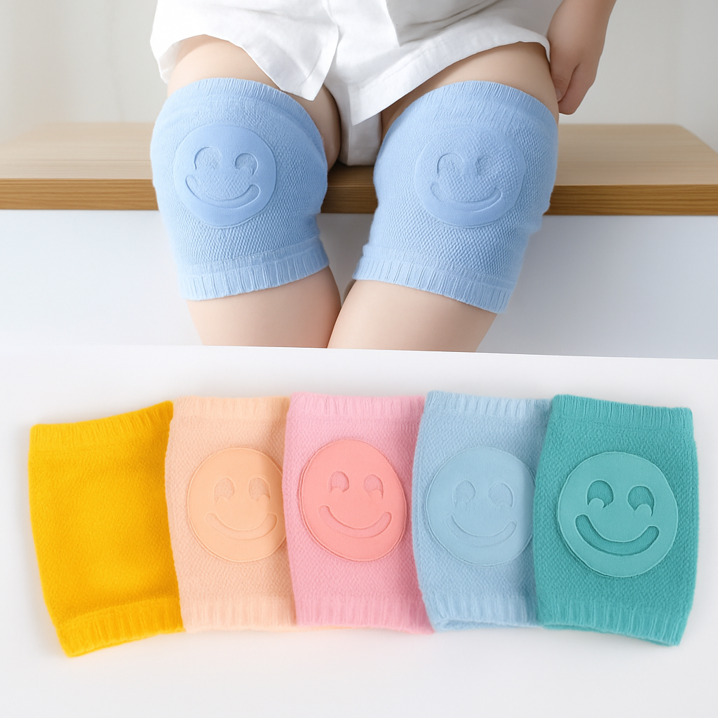 Children's knee pads with smiley face design in various colors on a white background.