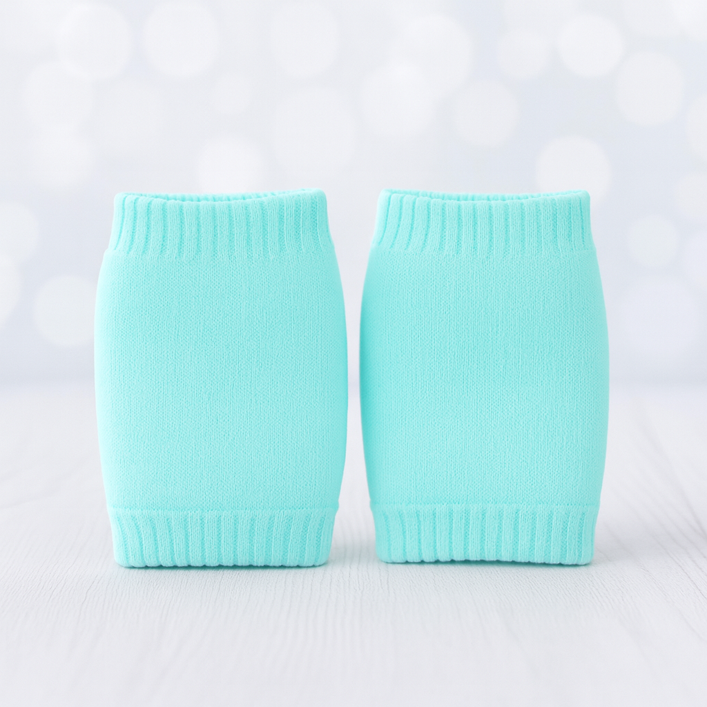Two turquoise knitted sleeves on a light gray background